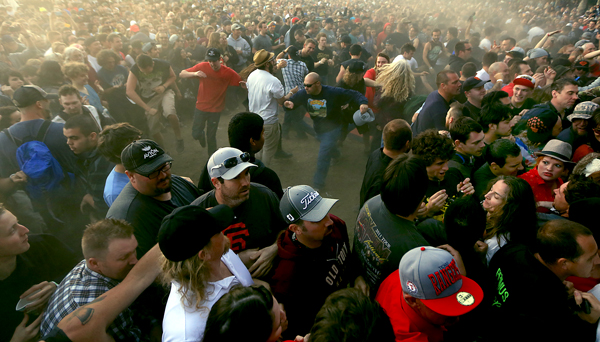 participates in a mosh pit crossword